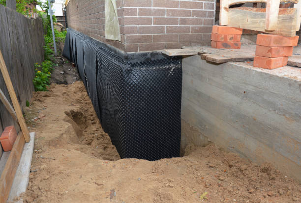Happy homeowners after waterproofing job in Birch Run